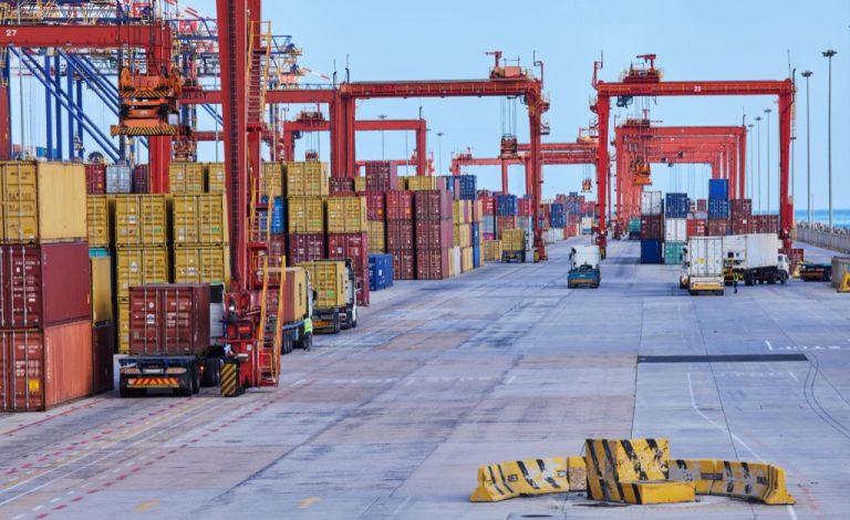 Container port terminal with shipping cranes and trucks for mining chemical supply logistics to Africa