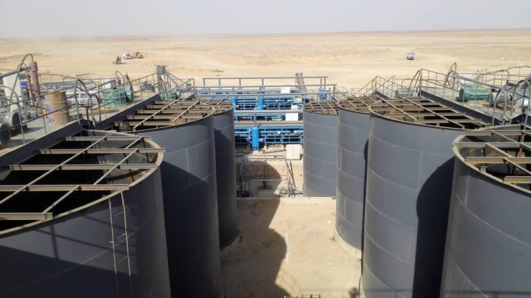 Gold processing plant leaching tanks in desert mining site