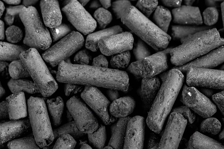 Close-up of activated carbon granules for industrial water and exhaust filtration media replacement
