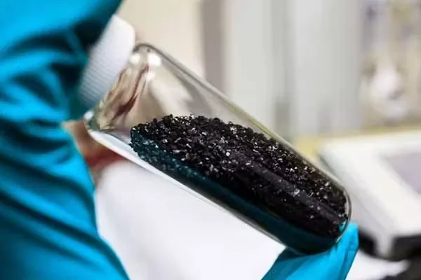 Coconut shell activated carbon granules in a laboratory sample jar